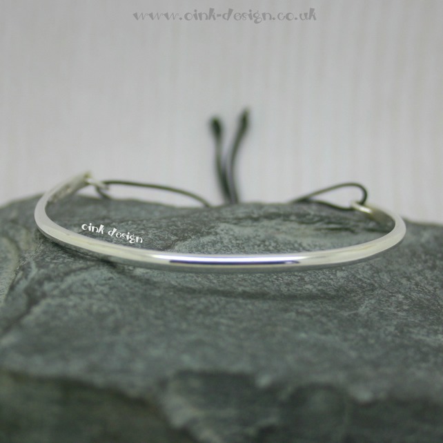 Sterling silver bangle with adjustable cord